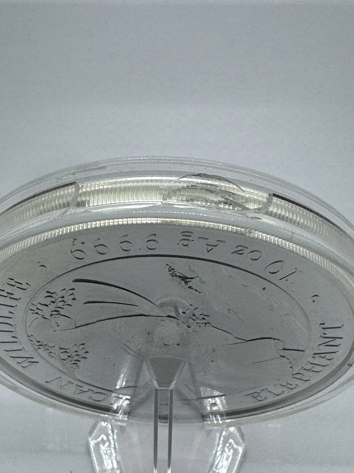 2023 Somalia 10 oz Silver African Wildlife Elephant BU Broken Capsule As Is
